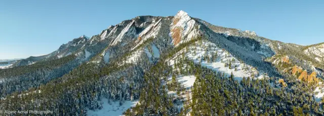Drone photo of the Boulder Flatirons in winter