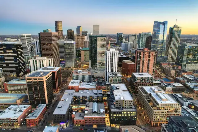 Drone photo of downtown Denver buildings and city streets from above