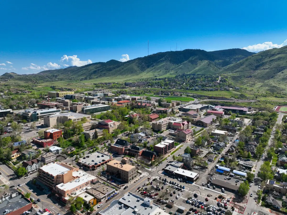 Aerial drone photo of Golden, Colorado and nearby foothills