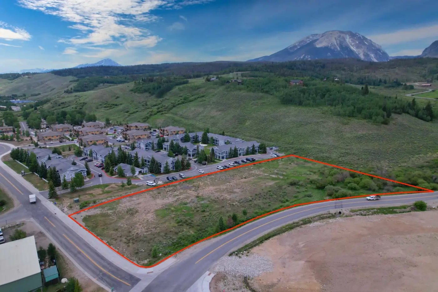 Drone photo of vacant Colorado land with access roads and surrounding terrain